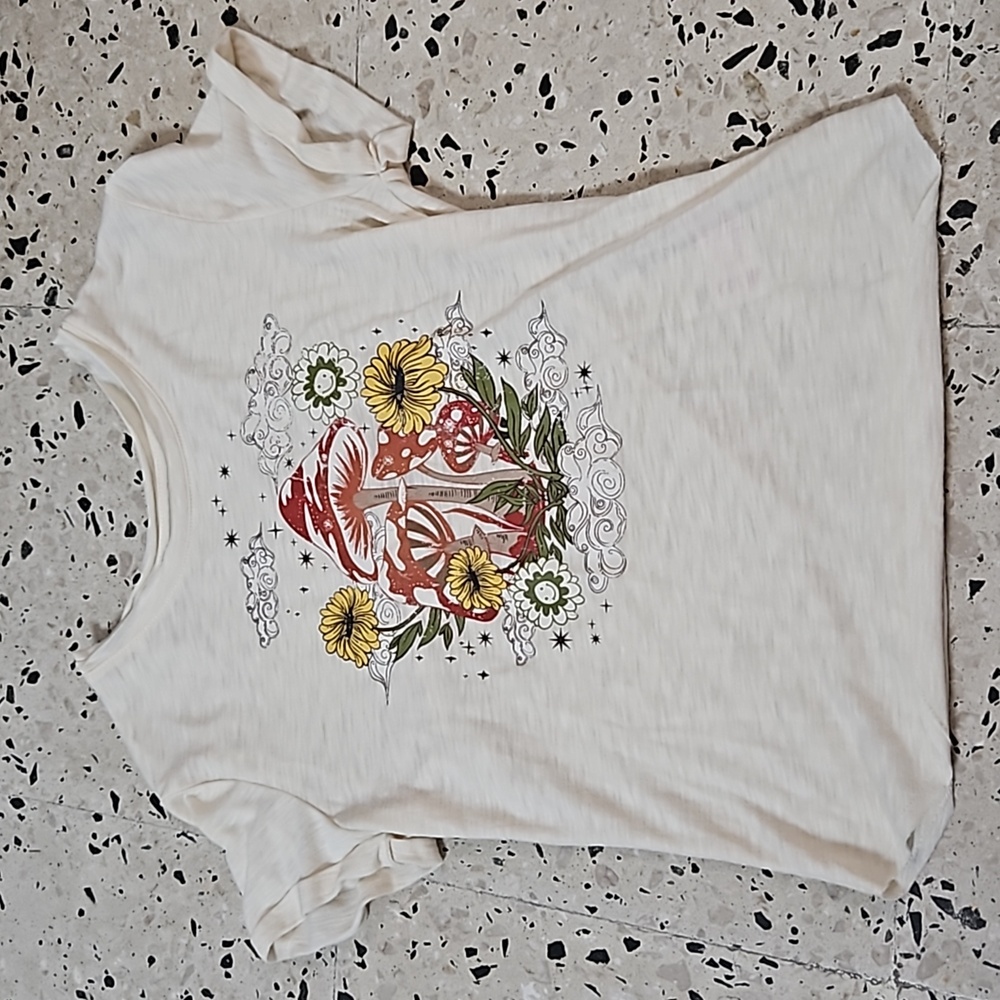 A cream colored mushroom printed design kids top